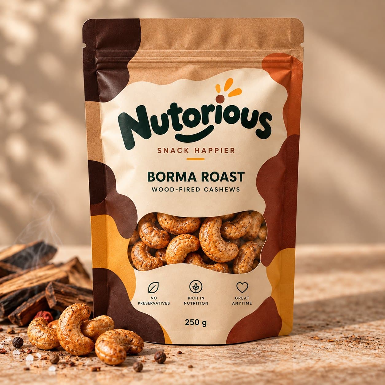 A Nutorious Borma Roast pouch beside charred wood and roasted cashews